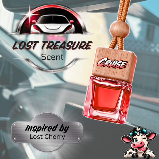A car air freshener pendant labeled 'CRUISE' with a red liquid-filled bottle design and a wooden top, shown against a blurred car interior background. Text reads 'LOST TREASURE Scent' and 'Inspired by Lost Cherry,' with a cow illustration in the corner.